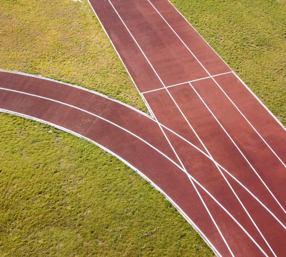 top-view-of-red-running-tracks-and-green-grass-law-2024-12-06-21-17-45-utc (1)